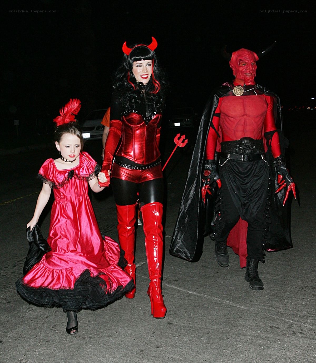 Family in devil costumes