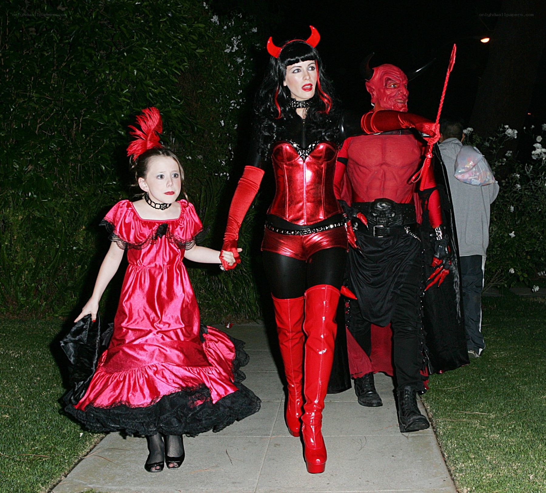 Family in devil costumes