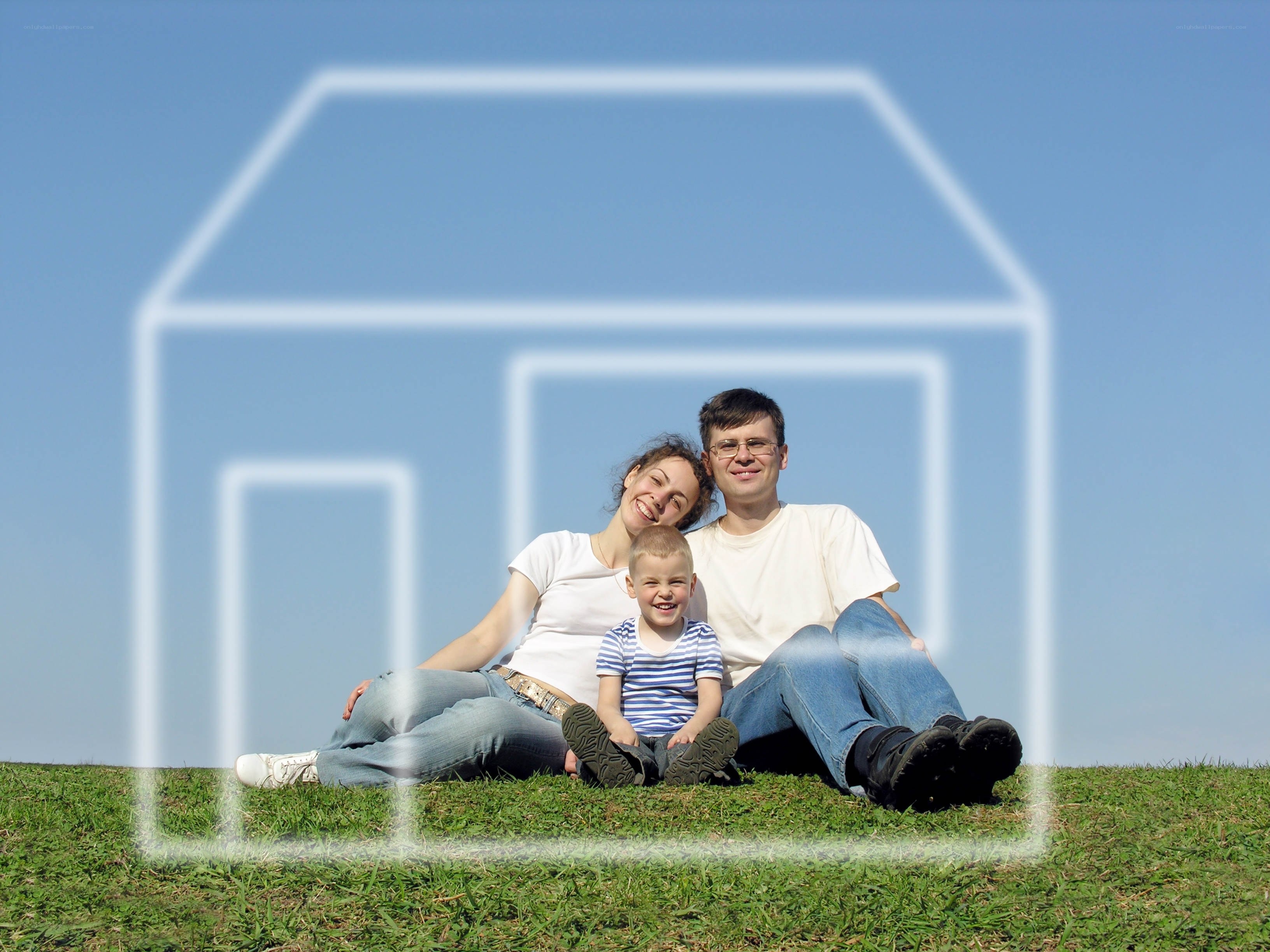 Family in front of house outline
