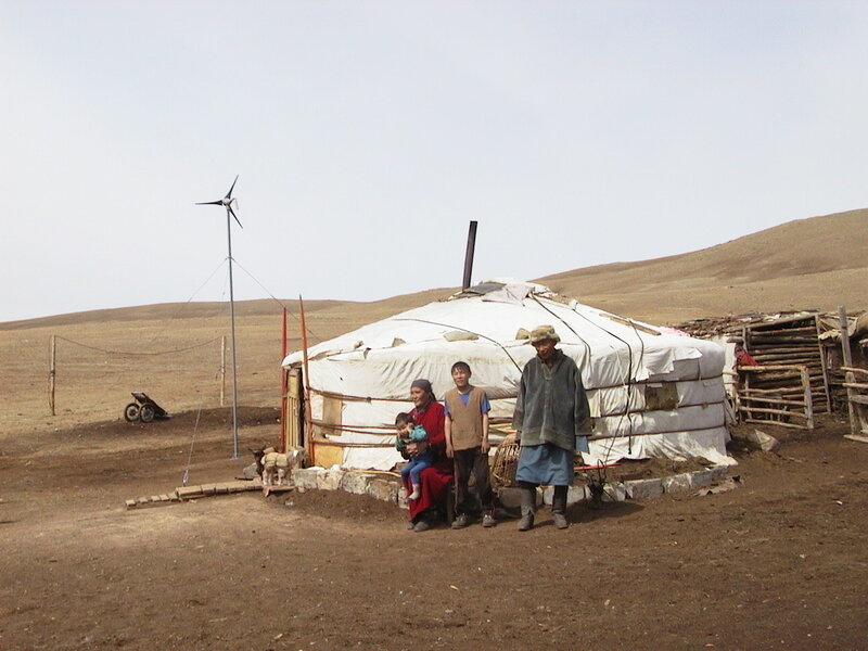 Family in front of yurt
