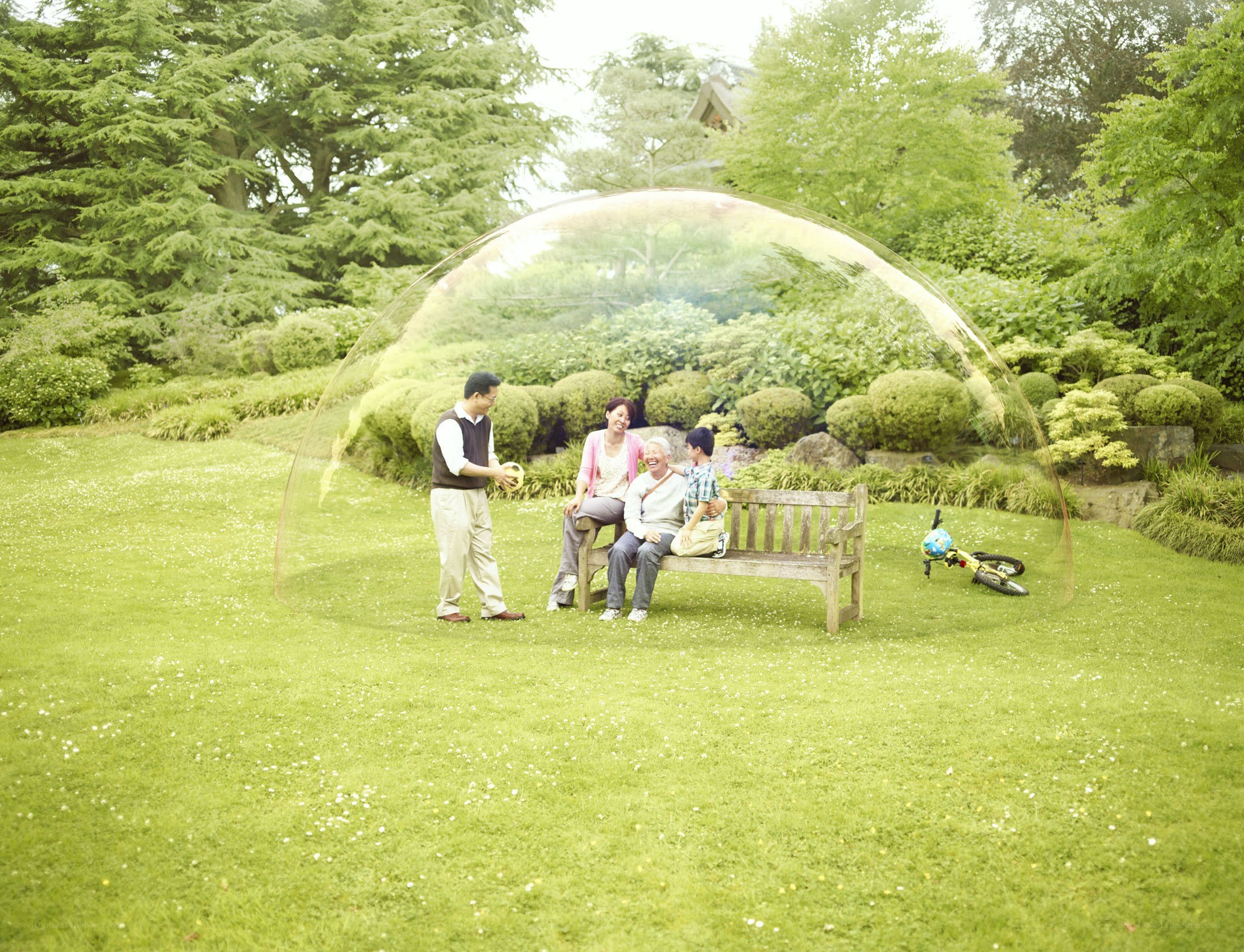 Family in garden bubble