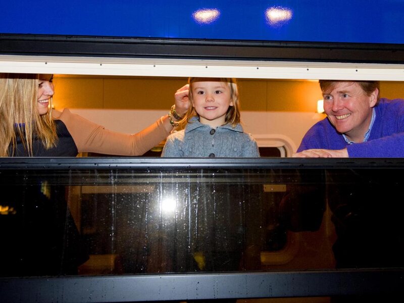 Family in Train Window — Blue