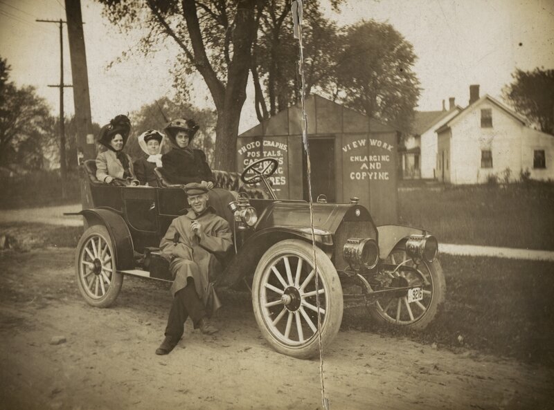 Family in vintage car