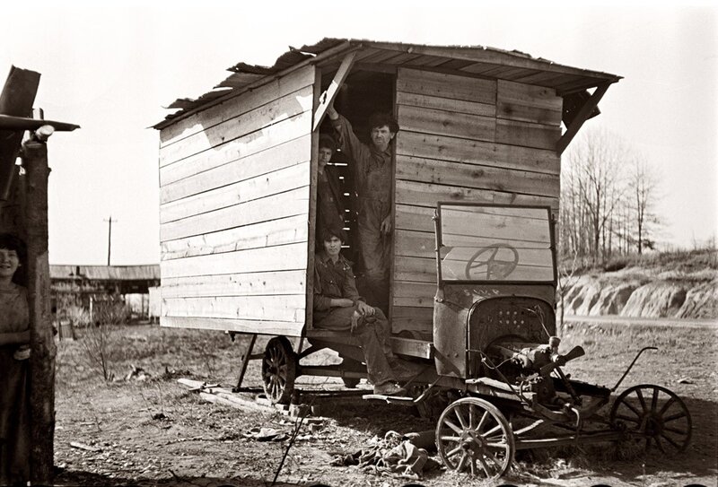 Family in wooden trailer