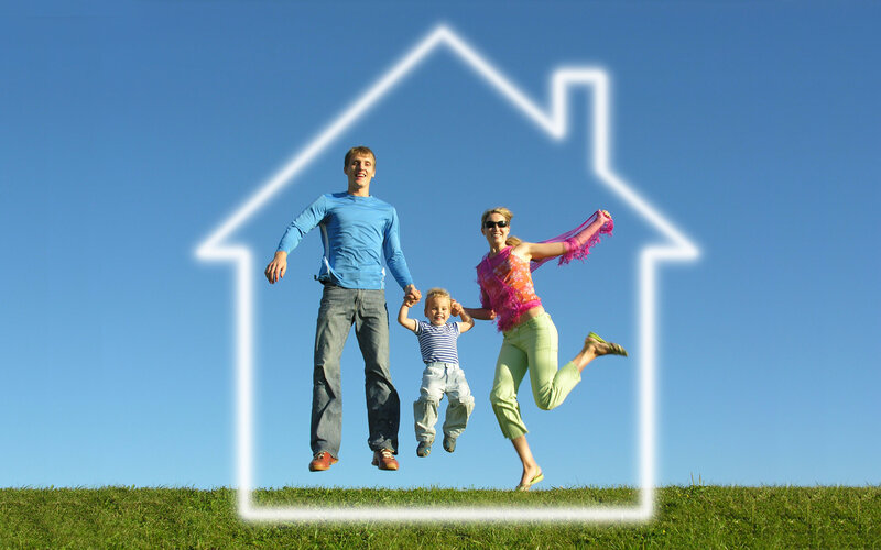 family jumping in front of house outline