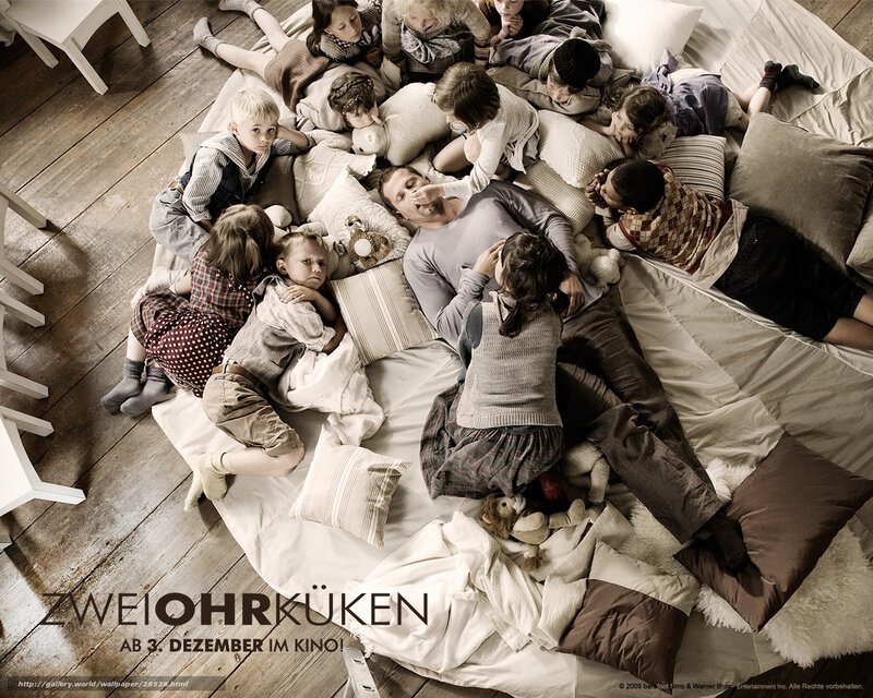 family on a bed with children
