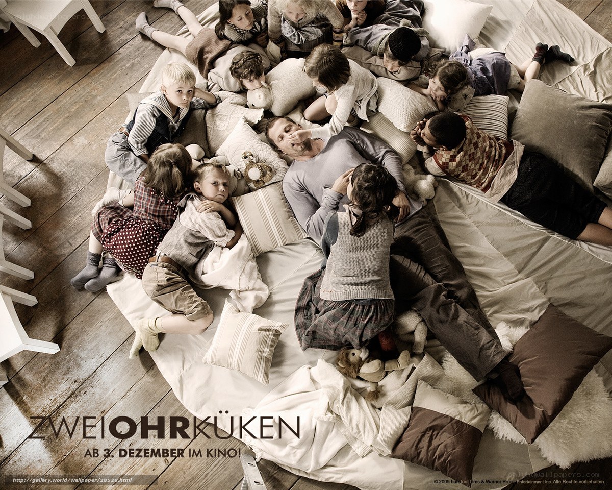 family on a bed with children