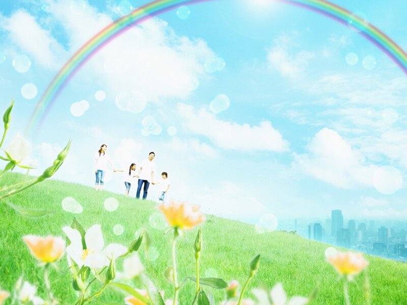 Family on a Grassy Hill