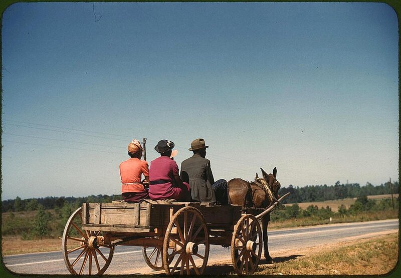 Family on a horse-drawn wagon