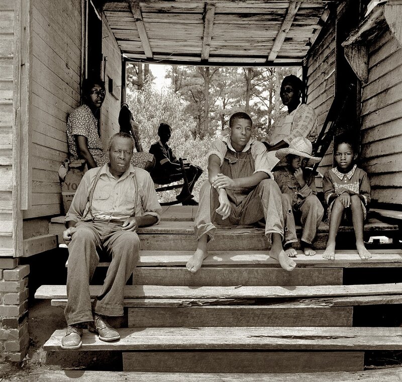 Family on a porch steps
