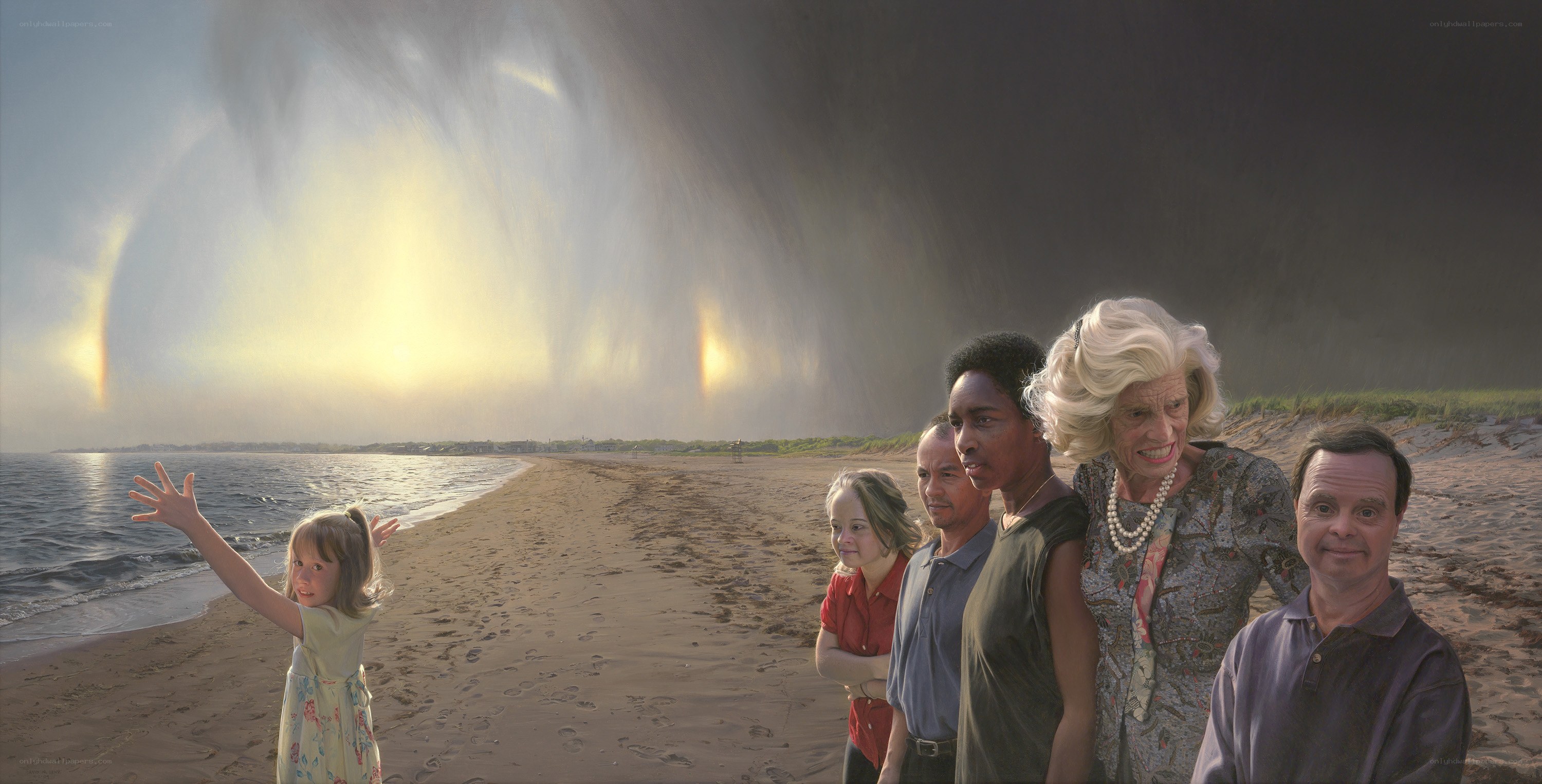 Family on beach with rainbow