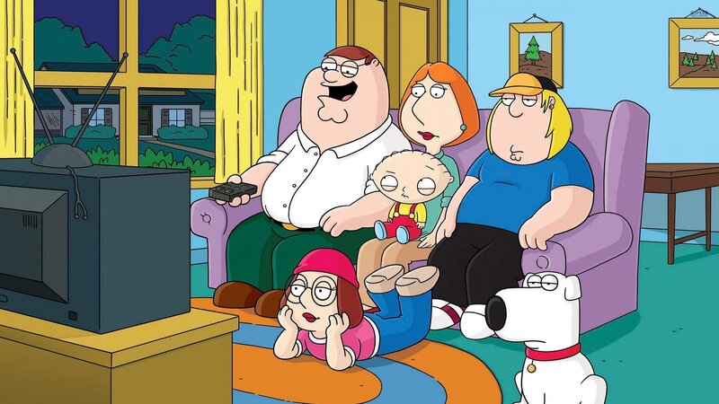 Family on Couch Watching TV