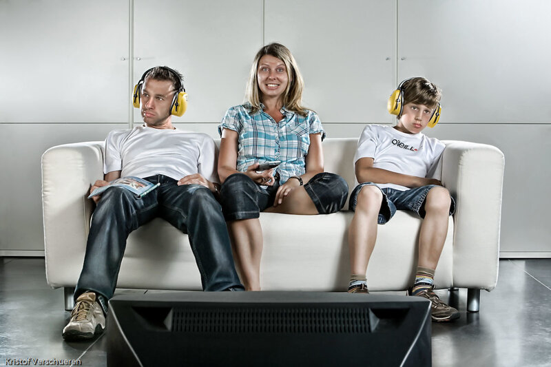Family on couch with headphones
