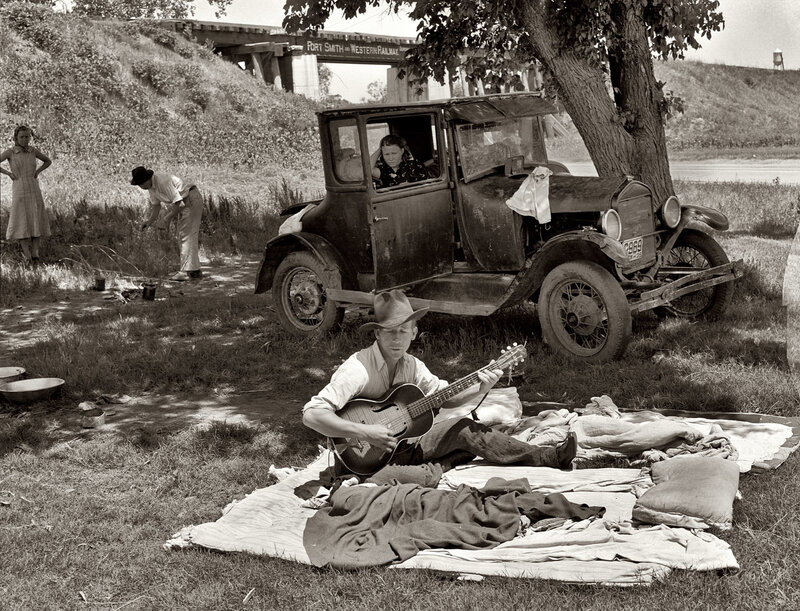 Family picnic by old car