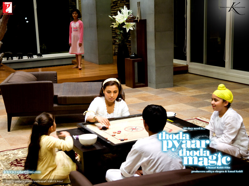 family playing carrom game
