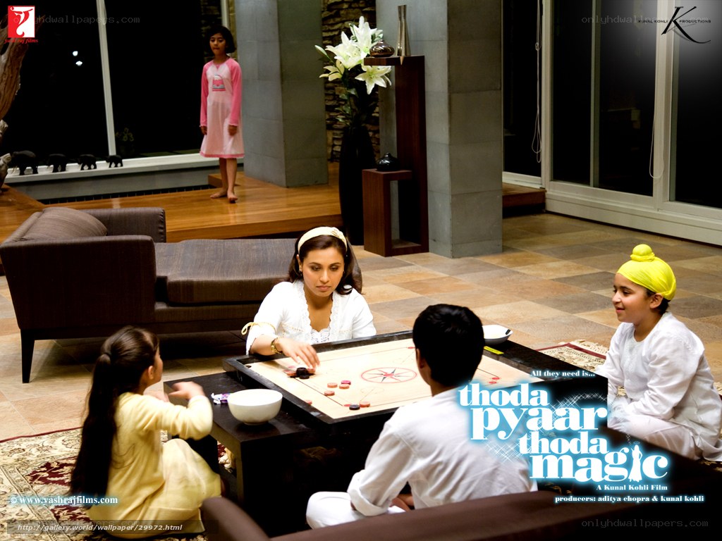 family playing carrom game