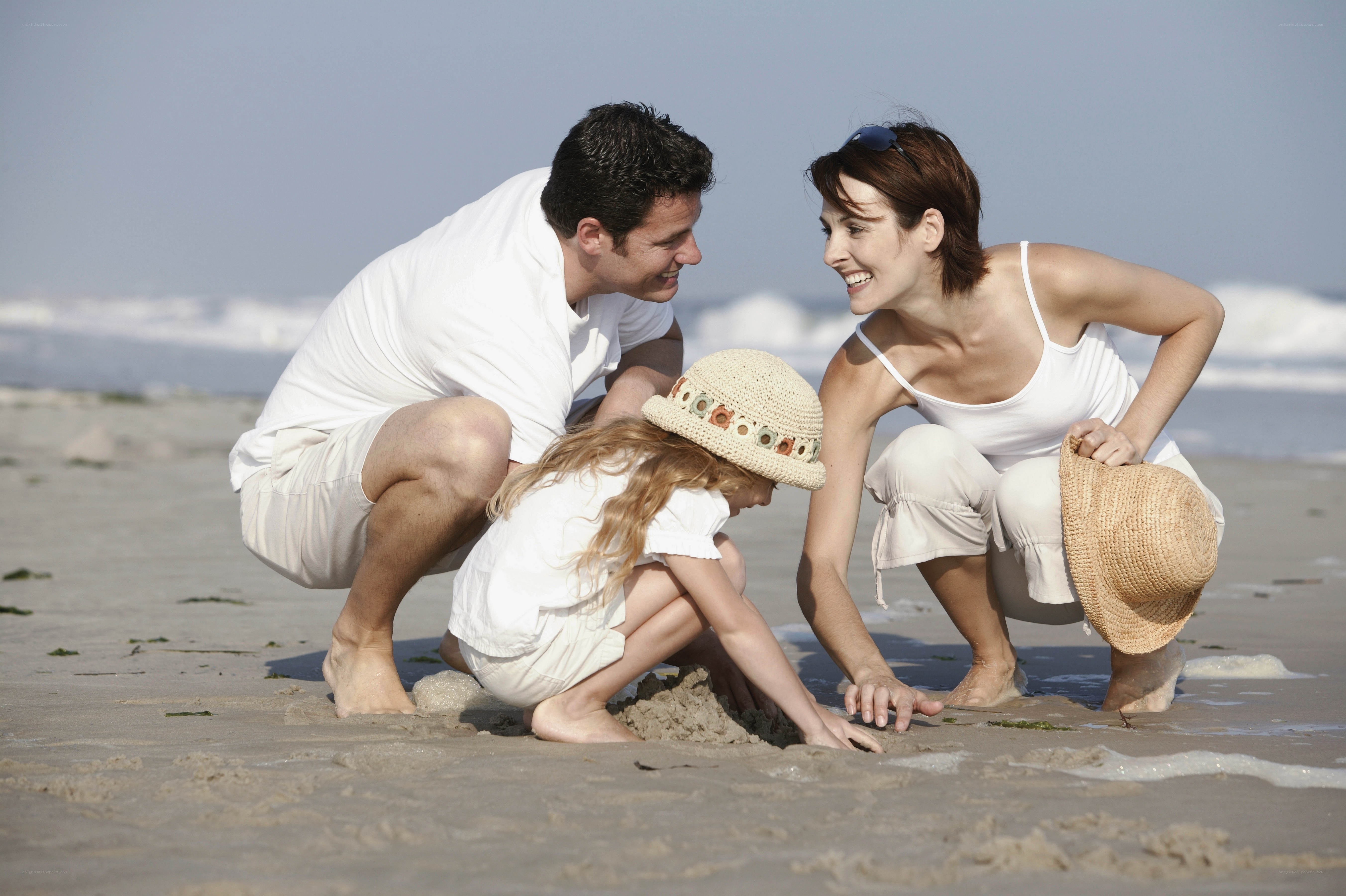 Family playing on the beach