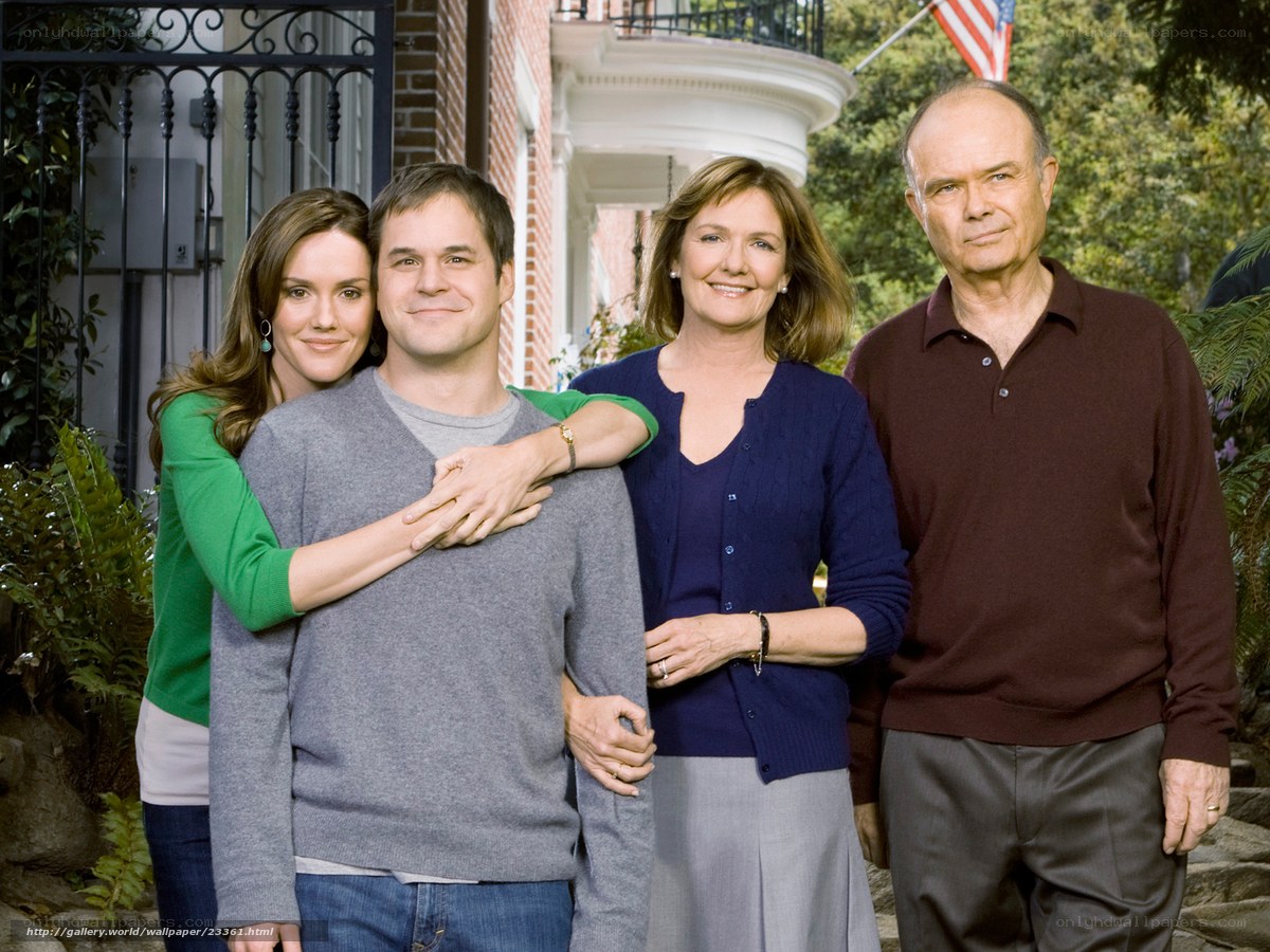 Family portrait in front of house