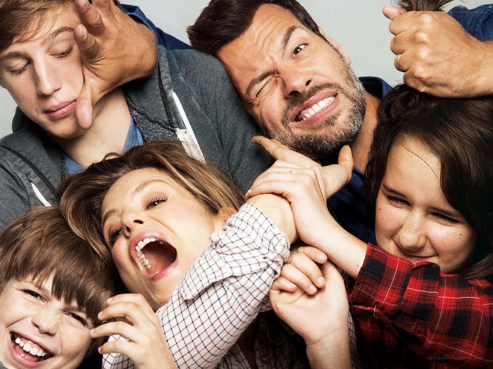 Family posing playfully together