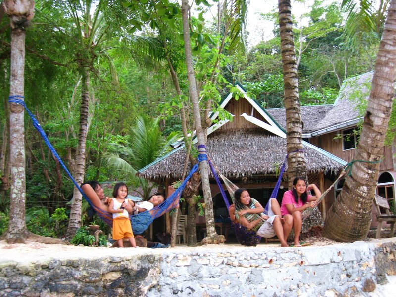 Family relaxing in hammocks