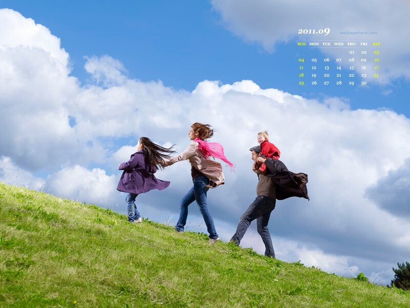 Family Running on Hill
