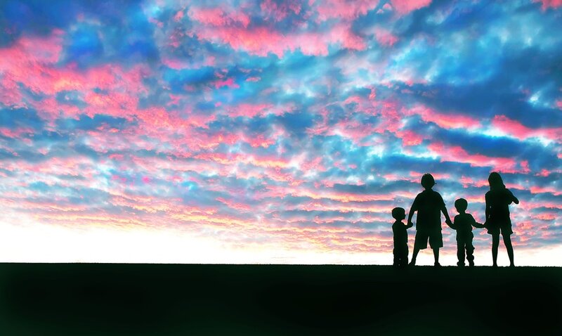 Family silhouette at sunset