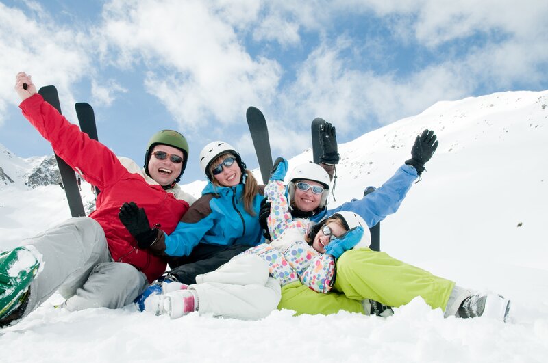 Family skiing in the snow