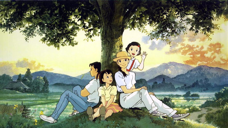 Family under a tree at sunset