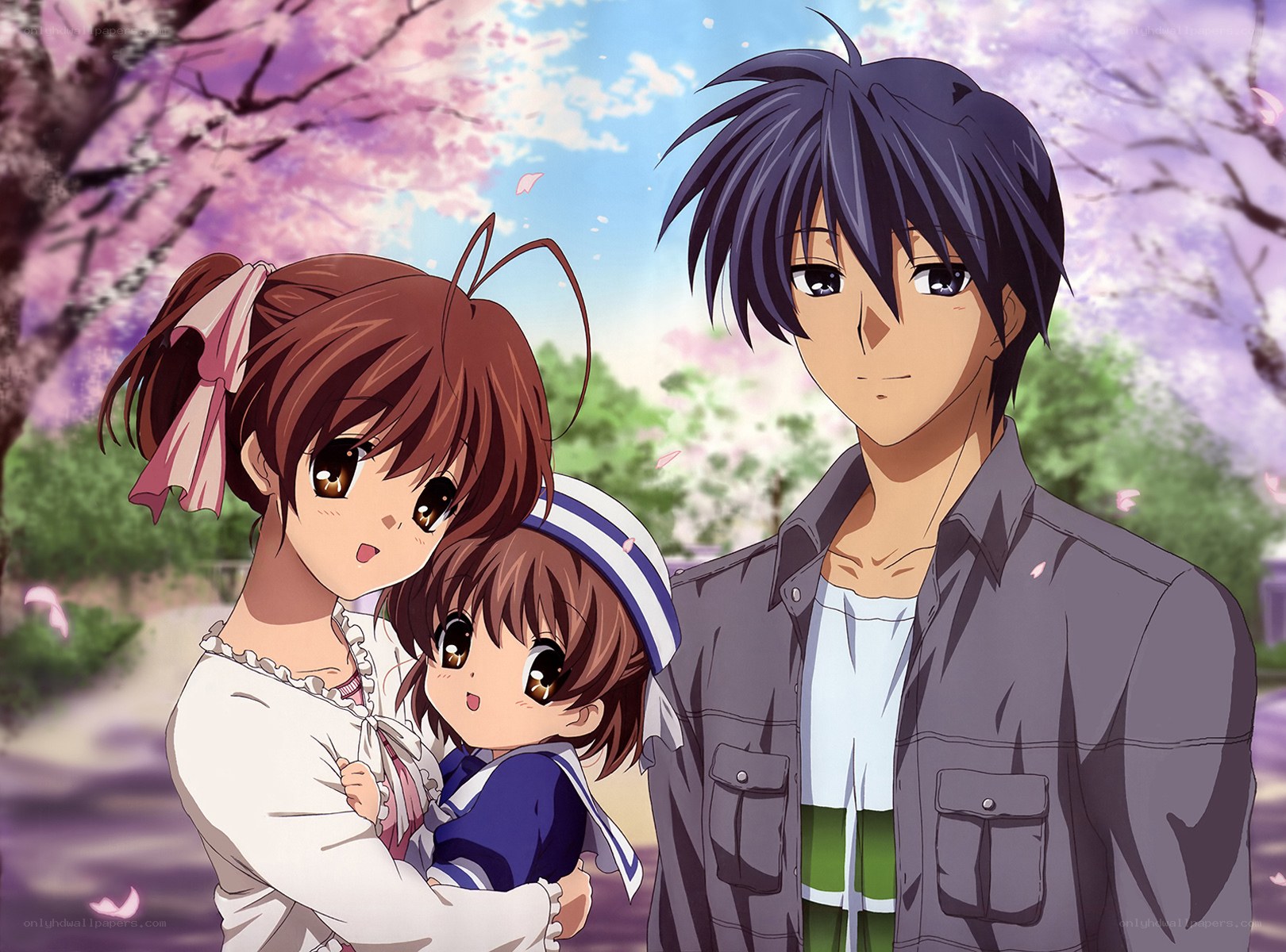 family under cherry blossoms