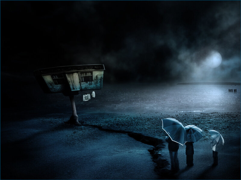 Family under umbrellas at night