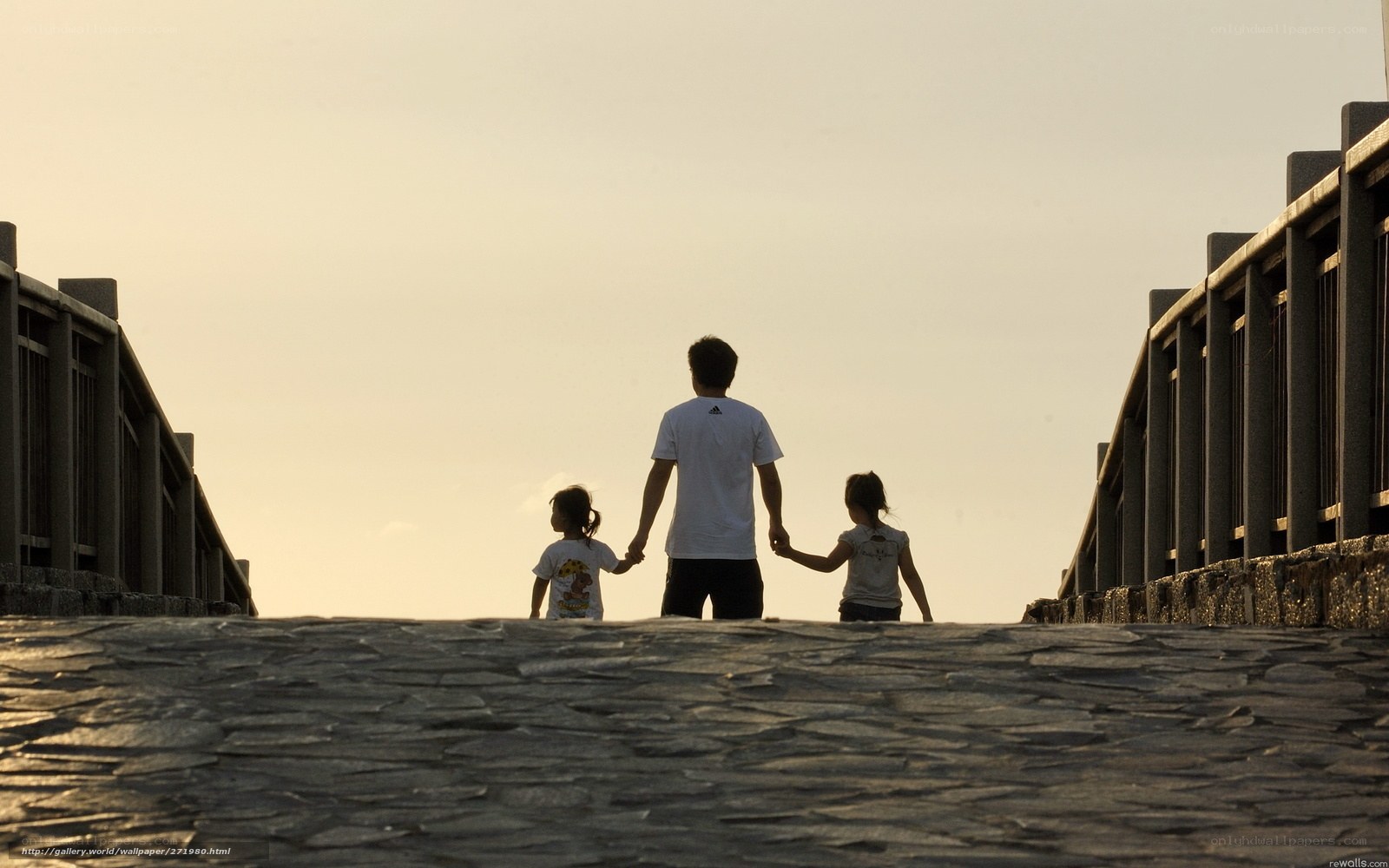 Family walking on a bridge