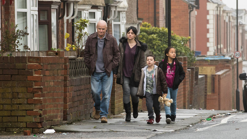 Family walking on a street