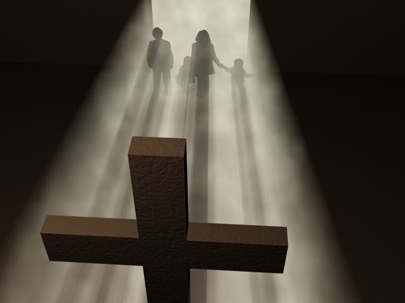 family walking toward light