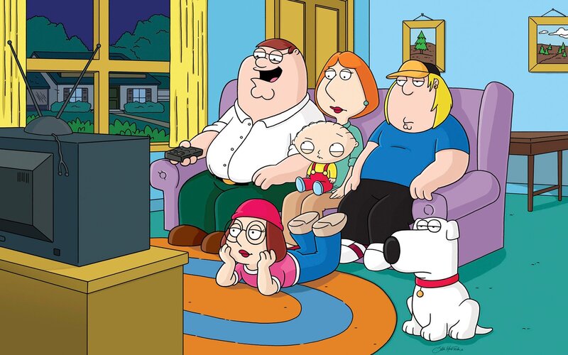 Family watching TV together