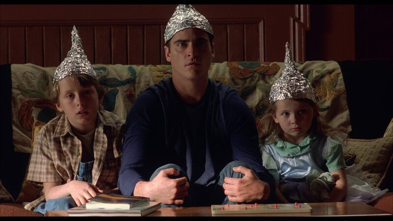 Family wearing tin foil hats