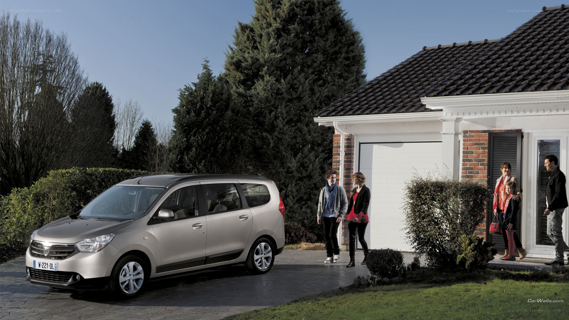 Family with car outside house