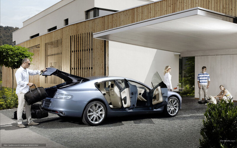Family with luxury car at home