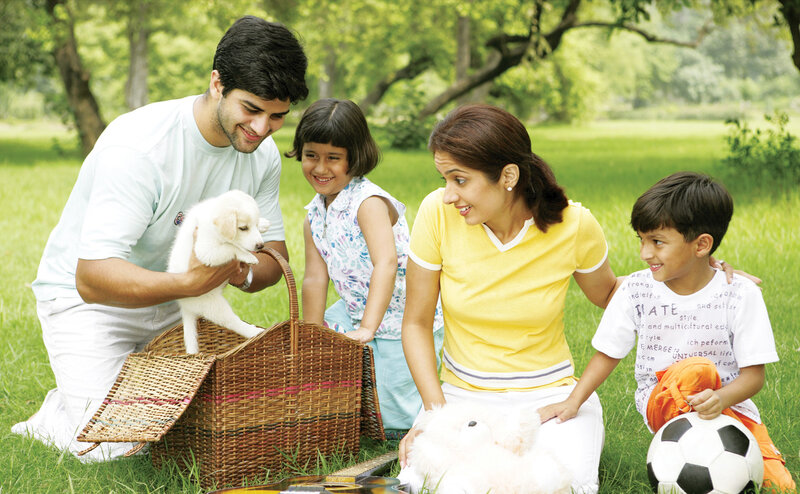 Family with Puppy in Park