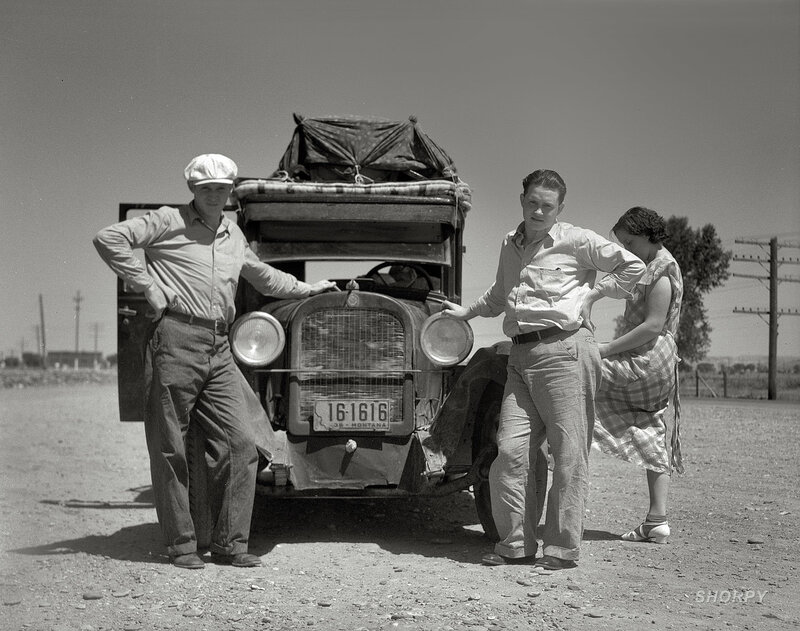 Family with vintage car on road