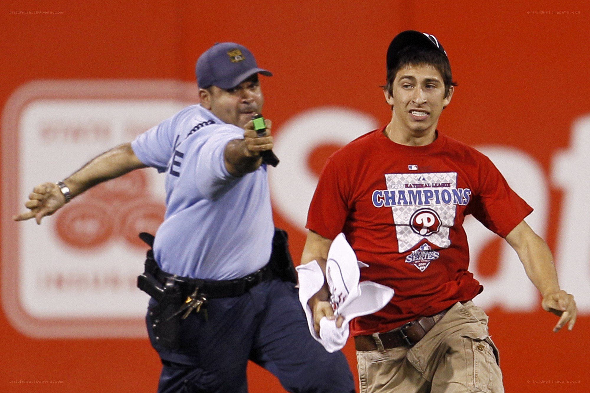 Fan chased by security at game