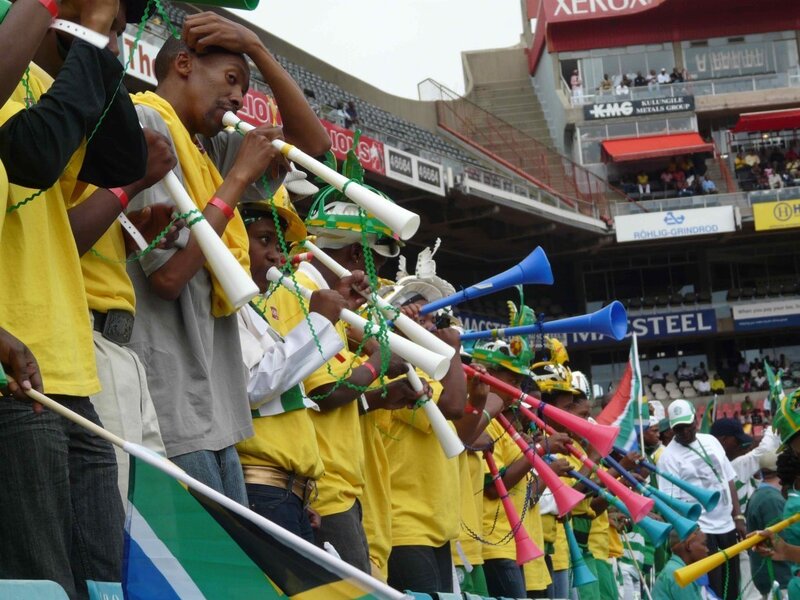 Fans cheering at a stadium