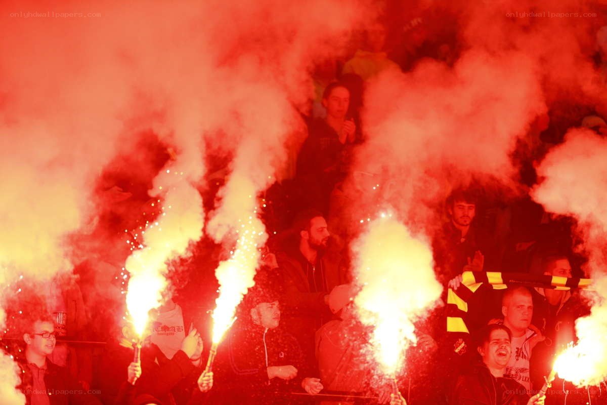 Fans with flares at a match