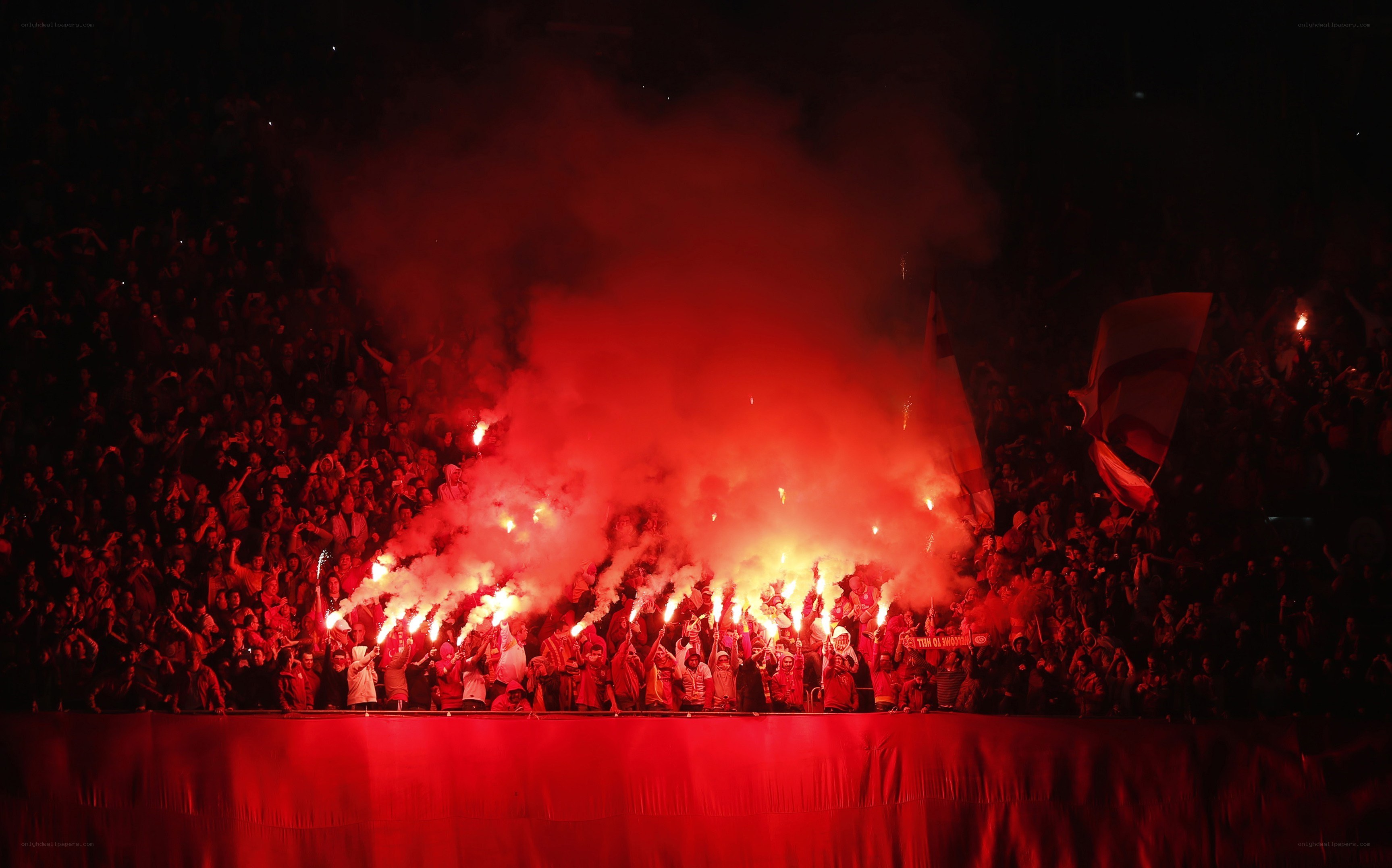 Fans with flares at a match