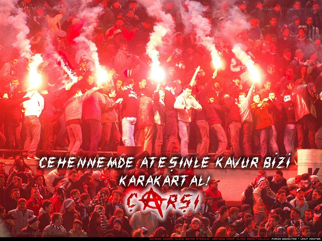 fans with flares at a stadium