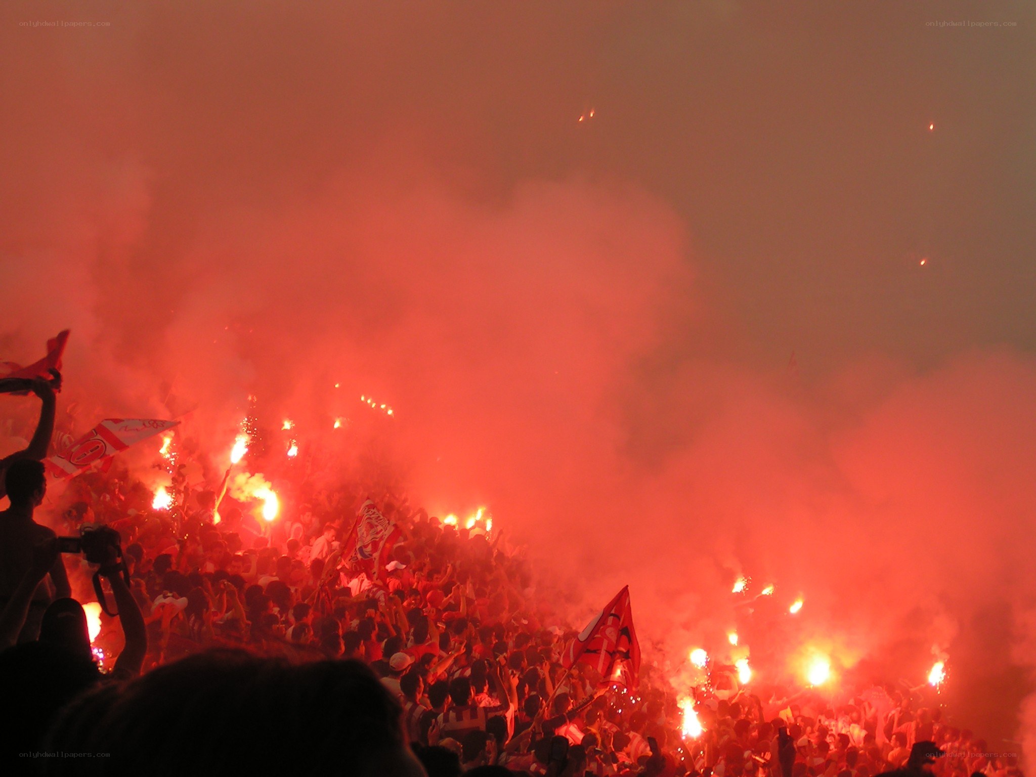 Fans with flares at a stadium