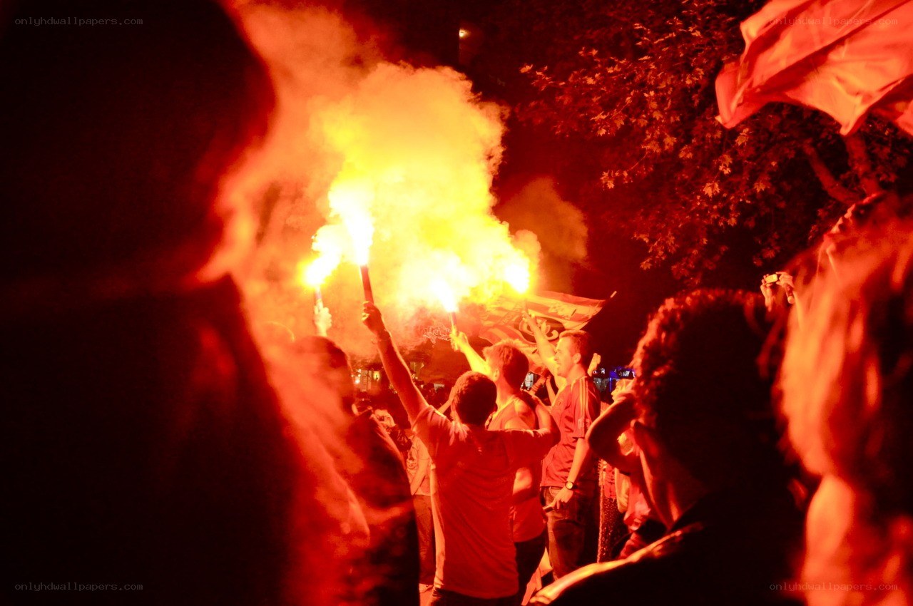 Fans with flares at night