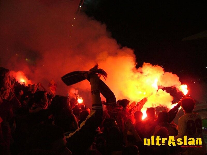 fans with flares at night