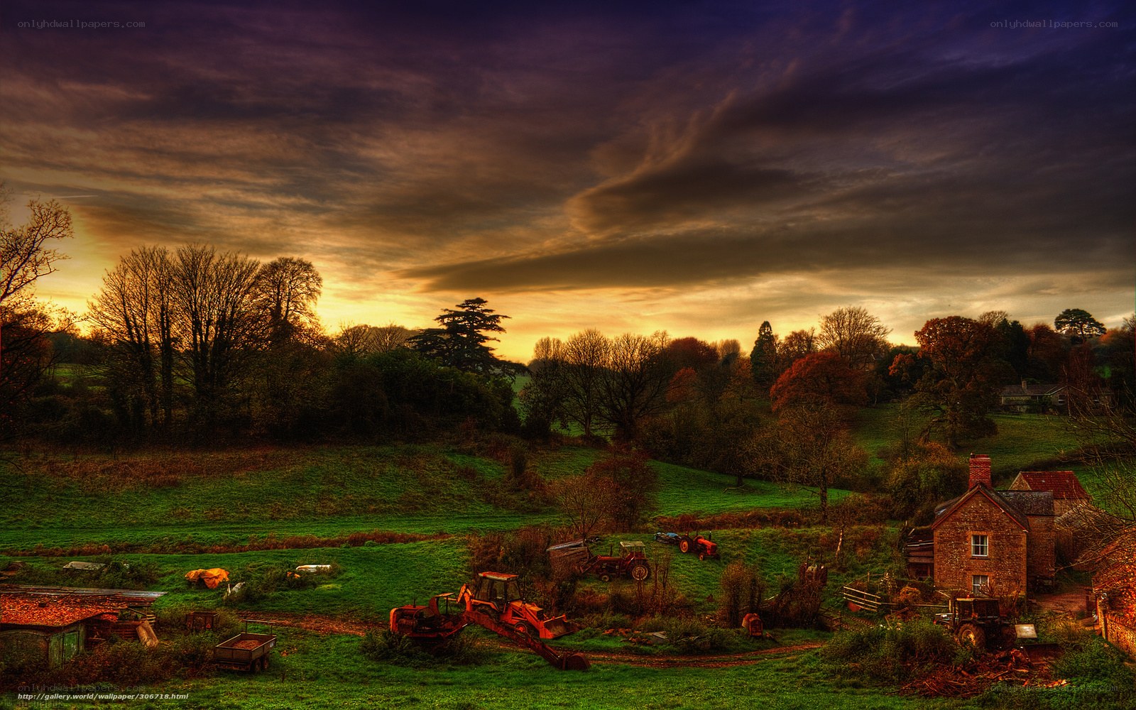 Farm at sunset with tractors
