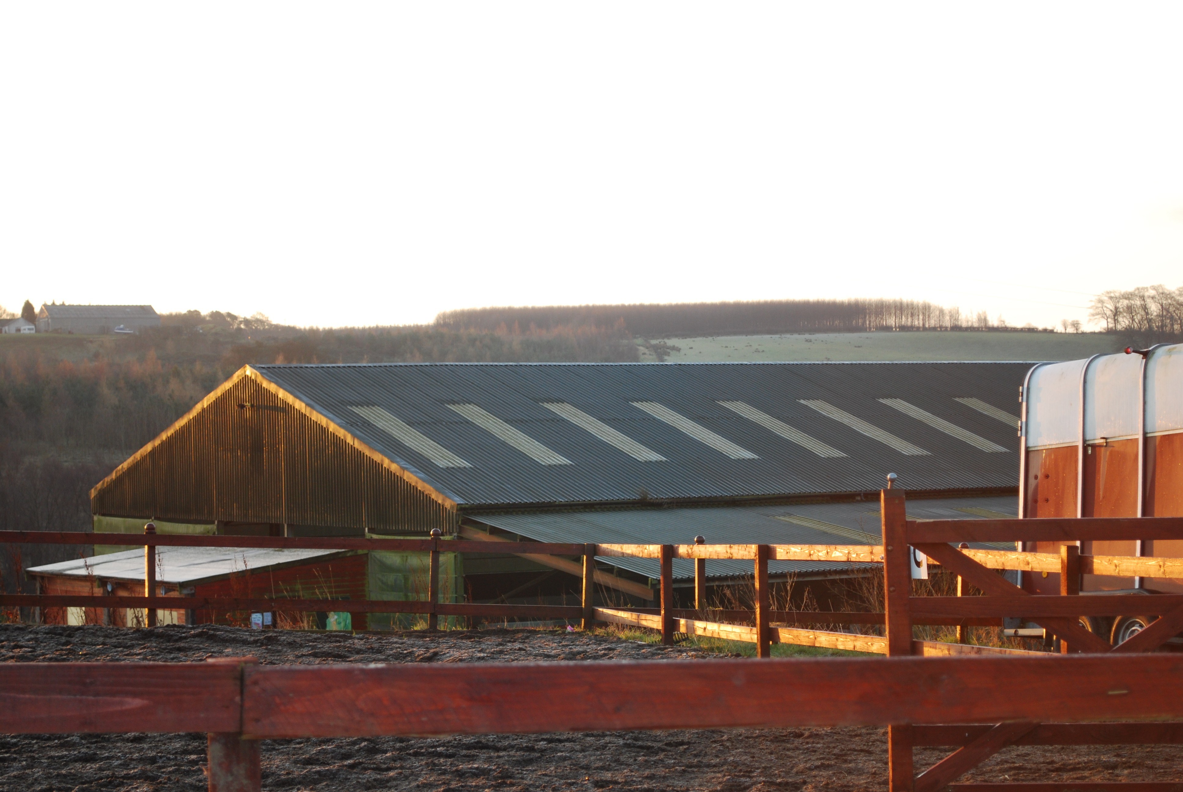 Farm barn at sunset