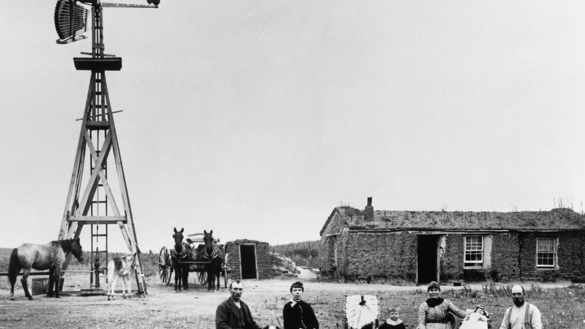 Farm family portrait with windmill